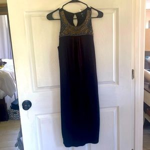 Very figure flattering! Size M black clingy dress w/built in slip. Beads perfect